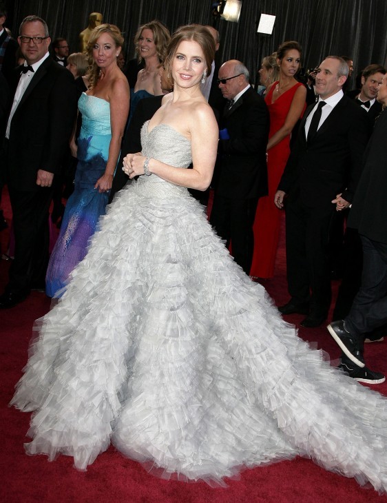 Red carpet photo of Amy Adams in a silver gown with feathers or ruffles or something