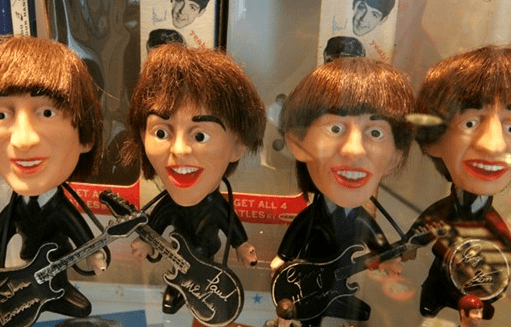 Photo of four Beatles bobblehead dolls resembling (barely) John, Paul, George and Ringo
