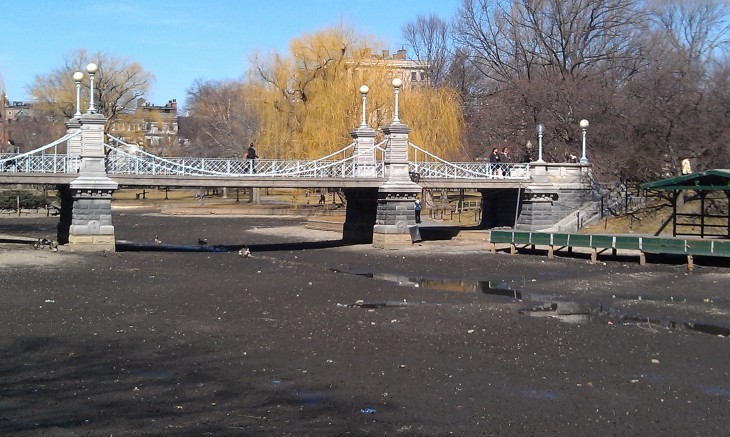 A photo of Boston Garden's pond with no water and a bare muddy bottom