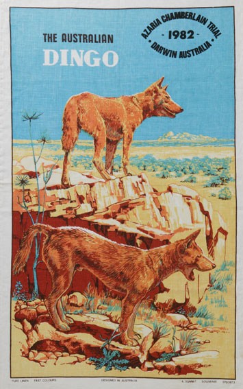 A tea towel bearing the word DINGO and images of those critters