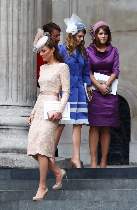 Photo of the Duchess of Cambrige in a snappy beige dress, descending stairs