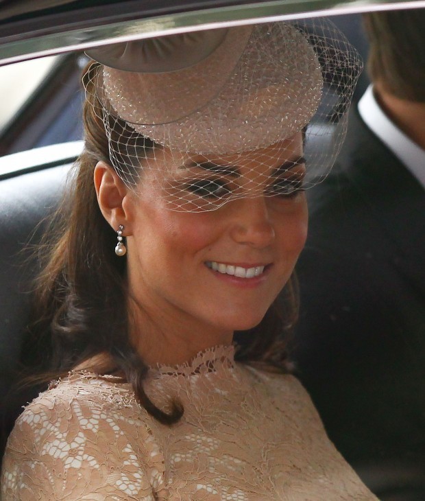 Photo of Catherine Duchess of Cambridge waving from inside a car