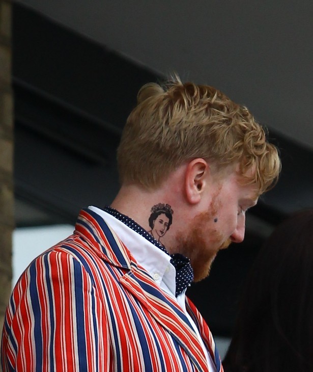 Photo of a man with a Queen Elizabeth tattoo on his neck