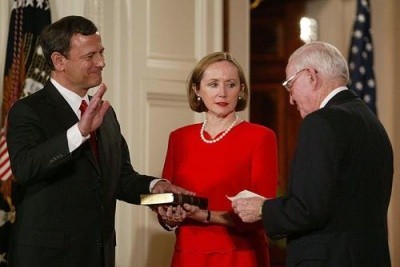 John Roberts is sworn in as Chief Justice in 2005, as his wife Jane looks on.  (Carrie Devorah / WENN)