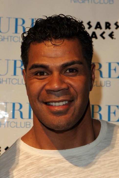 A photo of Junior Seau, smiling, in a T-shirt and looking muscular, at a movie premiere party in Las Vegas