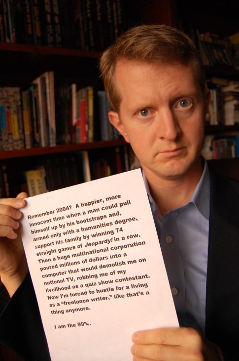 Ken Jennings holds up a sign saying 'I am the 99%' with a funny preamble