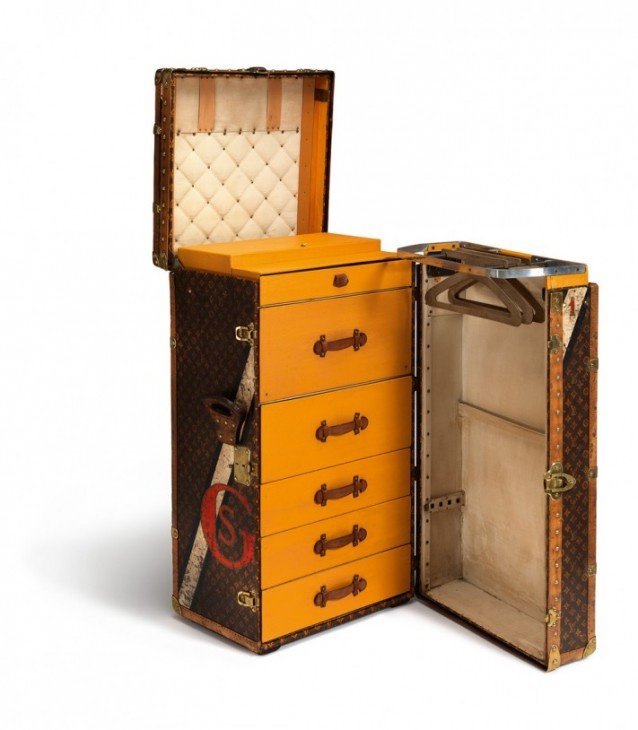Photo of a Louis Vuitton trunk with the door open to show cool drawers and hangers