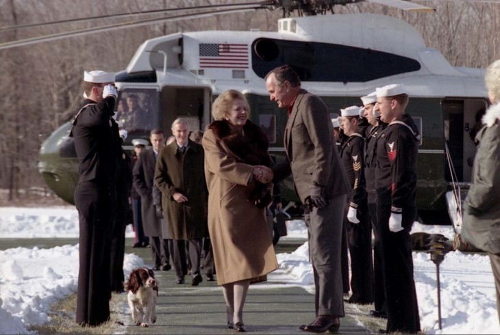 Photo of Margaret Thatcher in front of a helicopter, in snow, shaking hands with George Bush
