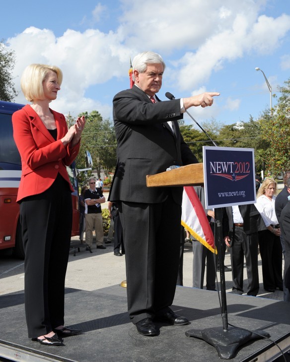 Photo of Newt Gingrich at a podium, pointing into the audience.