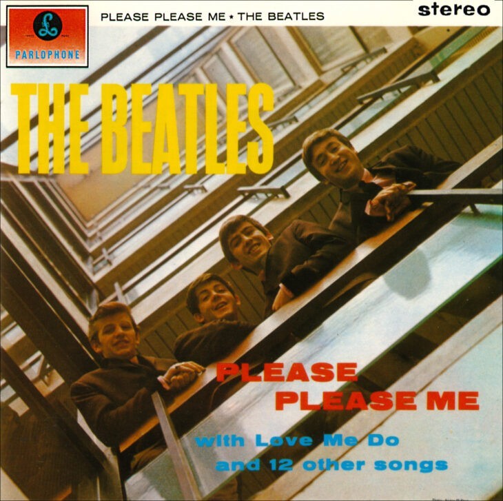 Album cover of Please Please Me, with the four Beatles looking over a modern stairway railing