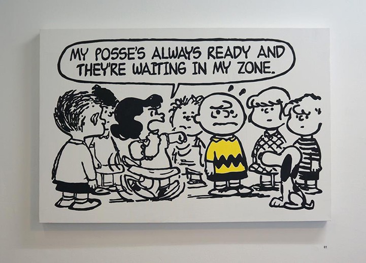 Lucy recites rap lyrics at Charlie Brown, ready to punch him, in front of a gang of kids