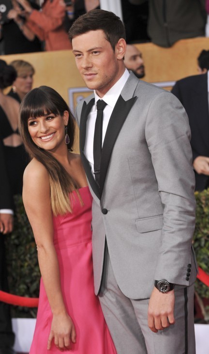Photo of Cory Monteith in a tux and Lea Michele in a gown on a red carpet
