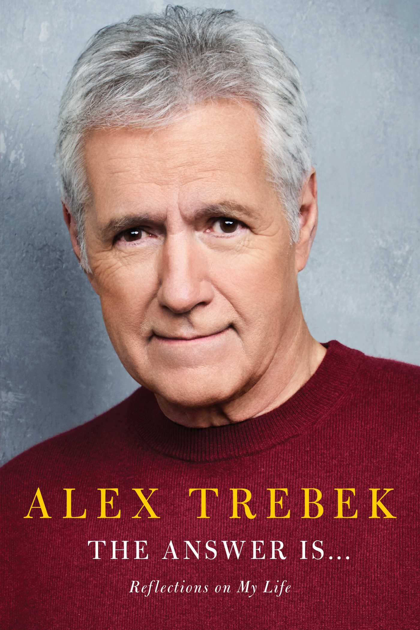Alex Trebek is gray-haired but tidy, with a small smile and a direct gaze, over the all-caps name ALEX TREBEK and title 'The Answer Is...'