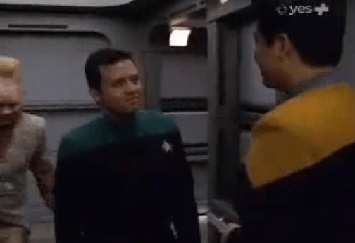 A 20-something Abdullah II, in a green Star Trek shirt, talks to a yellow shirt