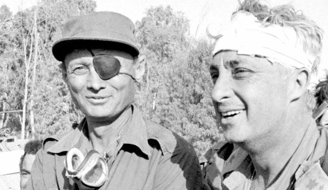 Moshe Dayan (left) and Ariel Sharon. Reuters photo via Haaretz.