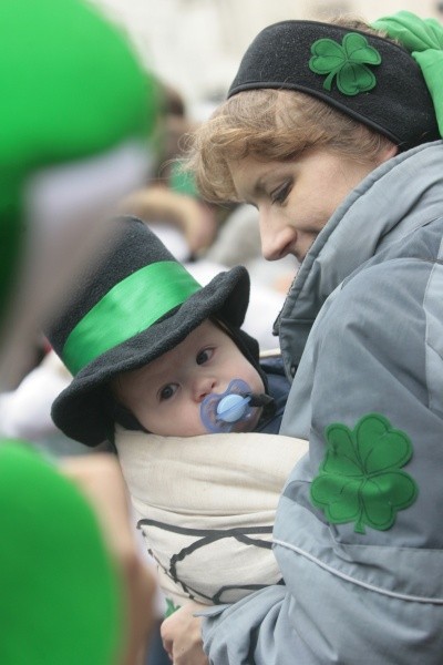 Photo of a baby in a top hat with a green band