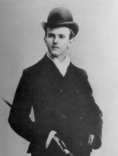 A photo of Calvin Coolidge, looking jaunty, in a suit and bowler hat
