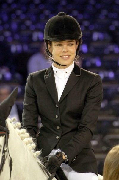 Charlotte Casiraghi photo in helmet and smiling on a white horse