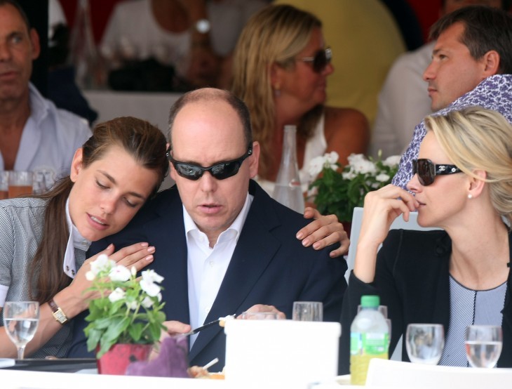 Charlotte Casiraghi photo, with her leaning on the shoulder of Prince Albert at a banquet table