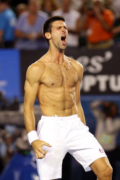 Novak Djokovic tears his shirt off and shouts for joy after Australian Open 2012 win