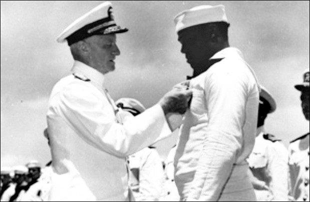 Receiving a medal from Admiral Nimitz