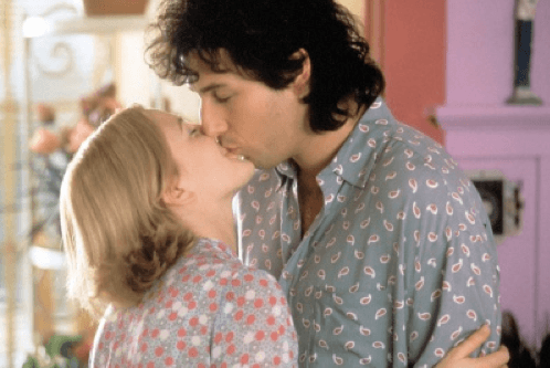 Photo of Drew Barrymore kissing a big-haired Adam Sandler
