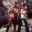 Photo of Fess Parker and Ed Ames in frontier and Native American garb, pointing