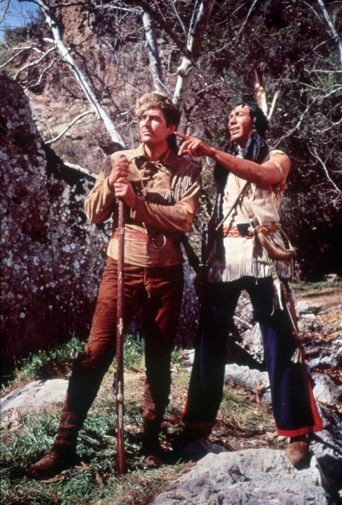 Photo of Fess Parker and Ed Ames in frontier and Native American garb, pointing