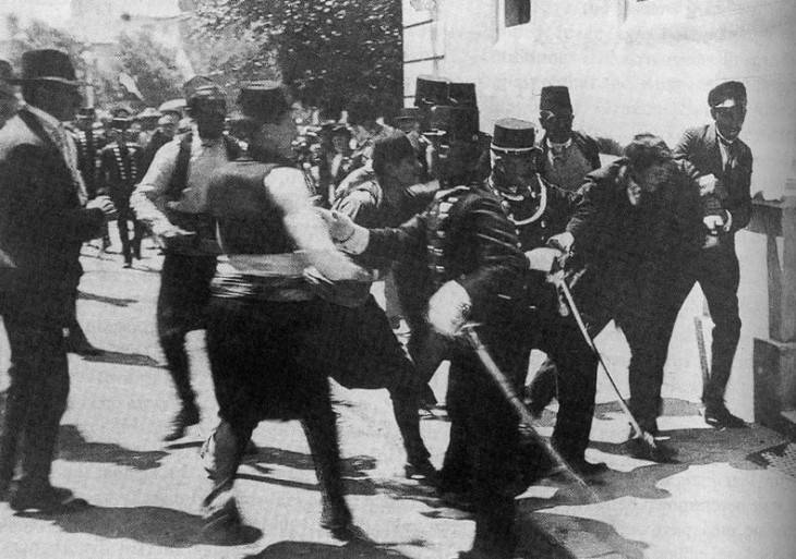 Guards wrestle with Princip right after the shooting