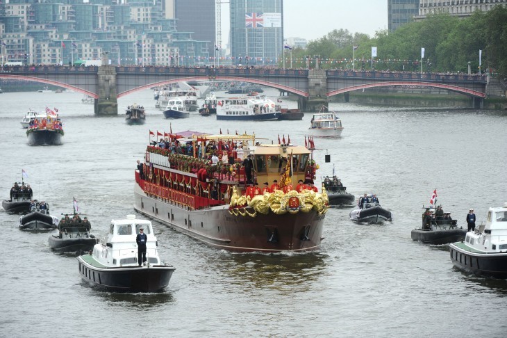 Photo of a large Royal barge, looking a bit like those shipping barges on the Rhine, floating up the Thames
