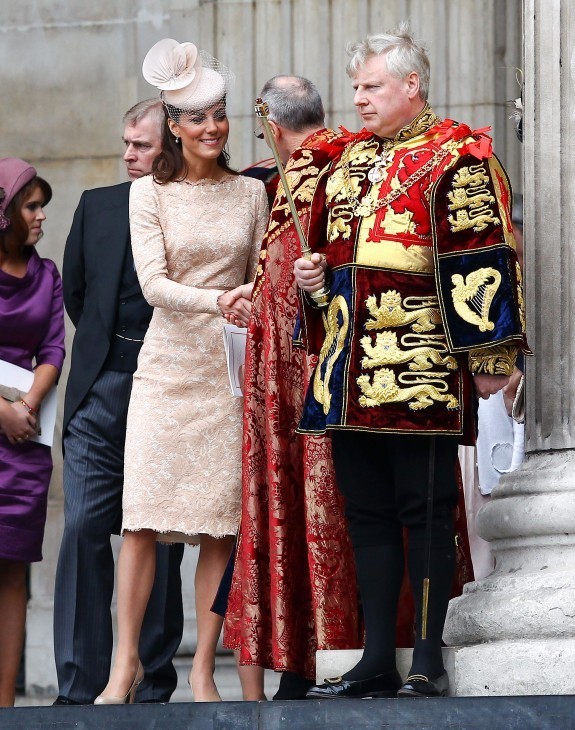 Photo of Kate Middleton and Prince William chatting with a church official