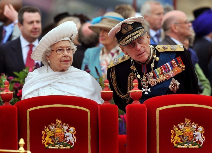 Queen Elizabeth photo on her barge, with Prince Philip leaning over to make a comment