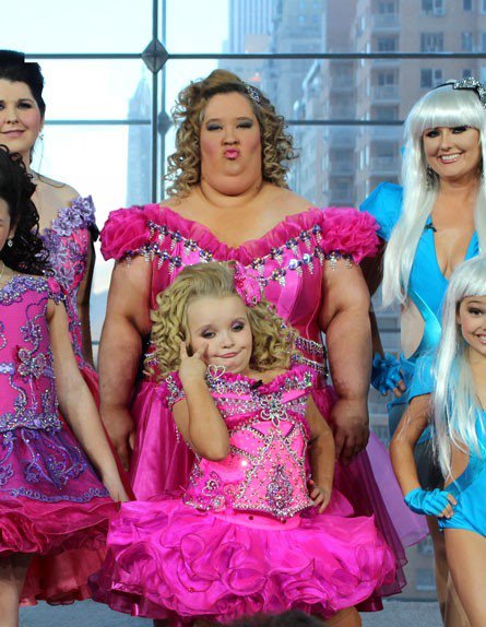 A photo of Honey Boo Boo in a pink pageant dress, with her mom in a horrifying matching outfit