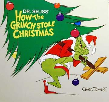 Photo of the Grinch sneaking away with a Christmas tree, grinning with evil glee