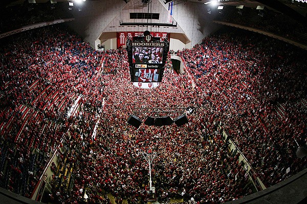 Fans flood the floor and seats of Indiana's basketball stadium