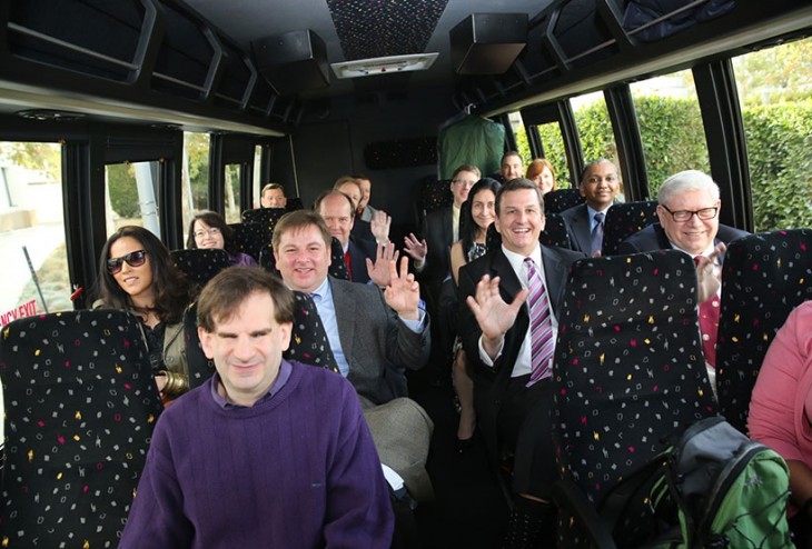 A photo of all 15 contestants on a shuttle bus ride, seen from the front