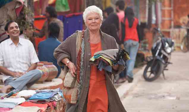 Dame Judi Dench, after charming a local with her haggling prowess.