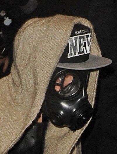 Justin Bieber photo in a gas mask, baseball cap and hoodie
