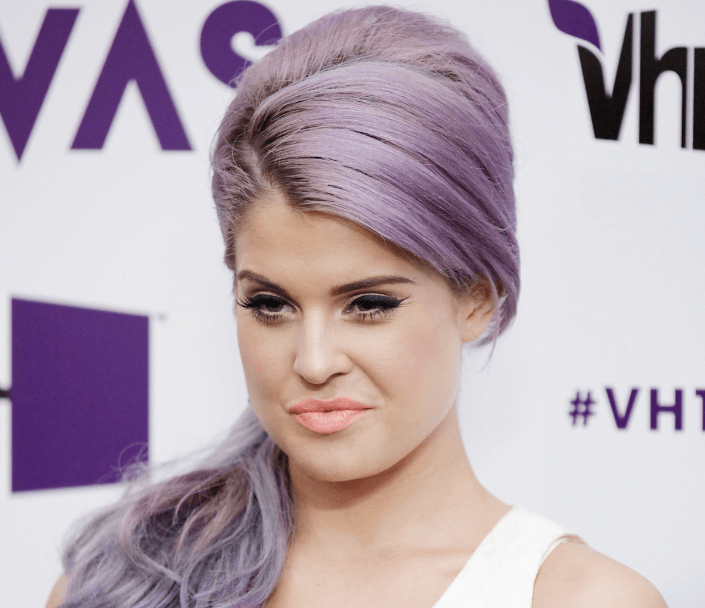 Photo of Kelly Osbourne with purple hair