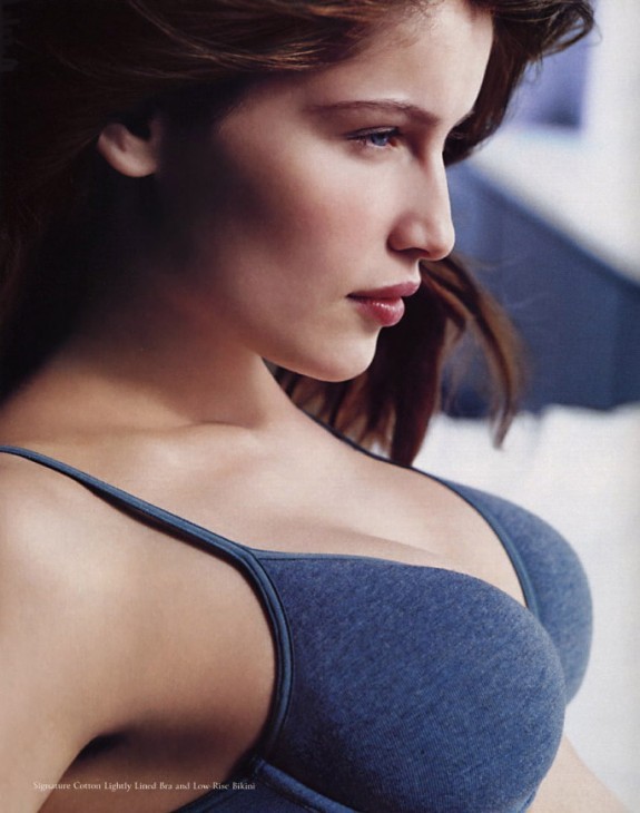 Photo of Laetitia Casta in a Victoria's Secret catalog, wearing a blue bra with her chest rather jutting out to the right
