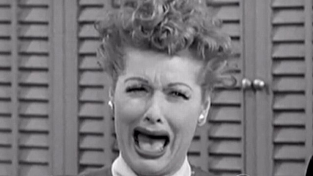 A photo of Lucille Ball with mouth wide open, wailing like a dope