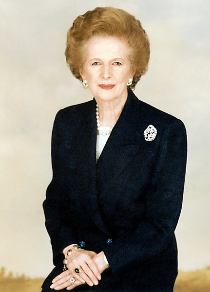 Photo of Margaret Thatcher in an official portrait, smiling, hair in her classic helmet style