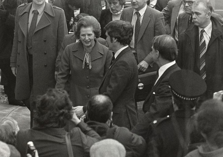 Photo of Margaret Thatcher in a crowd of admirers, outside, smiling