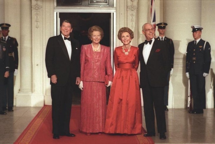 Photo of Ronald Reagan with Margaret Thatcher and spouses, standing for photos in formal wear