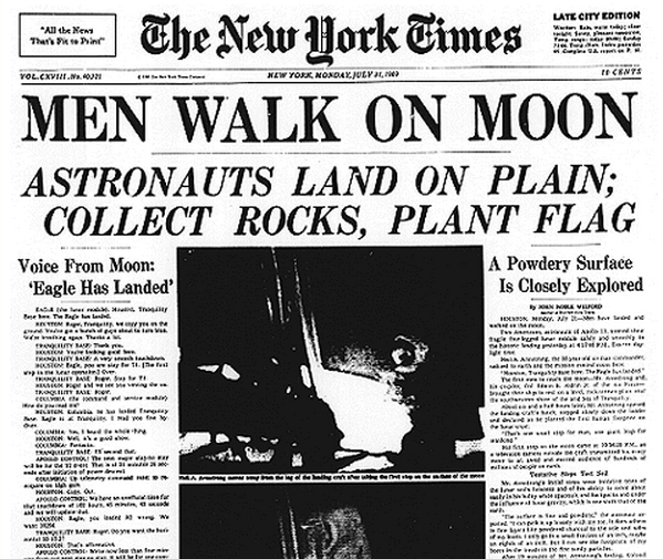 Newspaper with the headline MEN WALK ON MOON