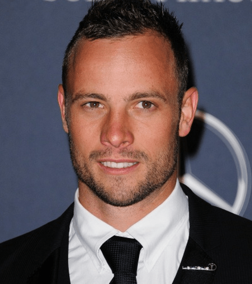 Oscar Pistorius photo, with him in black suit and short haircut at a fancy-dress event