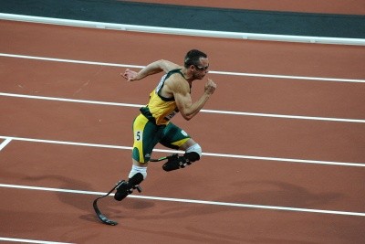 Oscar Pistorius photo, with the amputee running on bladed legs