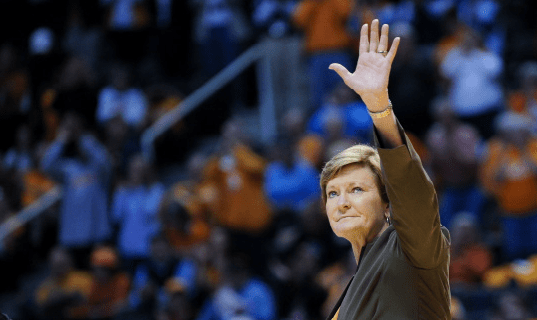 A photo of Pat Summitt waving goodbye in her final season