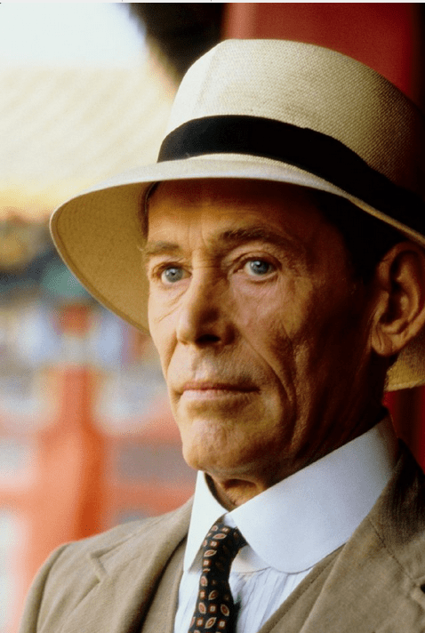 A photo of Peter O'Toole, with piercing blue eyes, in a tropical hat and light British suit