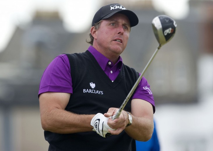 Photo of Phil Mickelson with a worried look on his face after hitting a driver